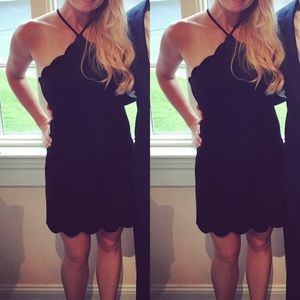 Lush scalloped hem open back little black dress